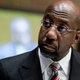 Senator Raphael Warnock (D-GA) listens to Dr. Philip Nathan Jefferson, of North Carolina, nominated to be a Member of the Board of Governors of the Federal Reserve System, during a Senate Banking, Housing, and Urban Affairs Committee confirmation hearing on Capitol Hill in Washington, DC on February 3, 2022